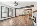 Bright open-concept living room with stone fireplace and hardwood floors at 1393 Westview Sw Dr, Atlanta, GA 30310