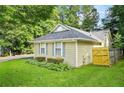 Cozy single-story home featuring a well-kept lawn and traditional design elements at 2107 Sandtree Sw Ct, Atlanta, GA 30331