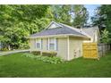 Cozy single-story home featuring a well-kept lawn and traditional design elements at 2107 Sandtree Sw Ct, Atlanta, GA 30331