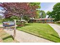 Charming brick home with a well-manicured lawn and an inviting curb appeal from the street at 3060 Wilson Rd, Decatur, GA 30033