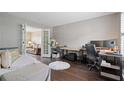 Cozy home office featuring hardwood floors, neutral walls, and ample desk space at 3235 Northcliff Dr, Suwanee, GA 30024