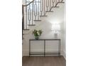 Close-up of staircase with custom metal railing and decor at 56 Pine St, Roswell, GA 30075