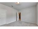 Bright, carpeted bedroom with two doors and neutral walls provides a cozy and versatile space at 1620 Branthaven Ln, Auburn, GA 30011