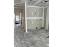 Unfinished living room featuring a framed wall and an open doorway to another room at 27 Benscot Dr, Austell, GA 30106