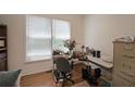 Bright home office space with a large window and ample desk space at 2892 Motts Cove Holw, Lawrenceville, GA 30043