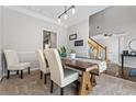 Dining area that has neutral walls with views of the staircase at 3174 Vickery Ne Dr, Marietta, GA 30066