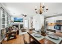 Open concept living and dining area with hardwood floors and abundant natural light at 505 Rendezvous Rd, Acworth, GA 30102