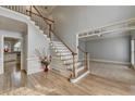 Spacious foyer with hardwood floors and staircase leading to the upper level at 340 Kincardine Way, Alpharetta, GA 30022