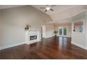 Spacious living room with hardwood floors, fireplace, and French doors at 102 Peaceful Vw, Acworth, GA 30102