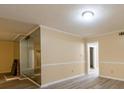 Bright living room with updated flooring, neutral walls, and a mirrored fireplace accent at 2986 Parc Lorraine, Lithonia, GA 30038