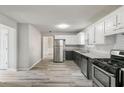 Spacious kitchen featuring stainless steel appliances, ample counter space, and sleek floors at 331 Overlook Turn Nw, Conyers, GA 30012