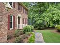 Close up of the front of the brick home, showing the walkway and landscaping at 2101 Breconridge Sw Dr, Marietta, GA 30064