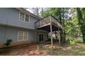 View of the deck, sliding doors, and back exterior of the house at 345 Deerwood Dr, Suwanee, GA 30024