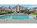 Inviting backyard pool and lounging area, perfect for outdoor entertaining at 1225 Elk Ridge Cv, Alpharetta, GA 30005