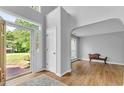 Light-filled foyer with hardwood floors, a large doorway and view of the front yard at 190 Crestworth Ct, Powder Springs, GA 30127
