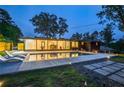Stunning backyard with a modern pool, lounge chairs, and manicured landscaping at 2648 Varner Ne Dr, Atlanta, GA 30345