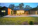Contemporary home exterior boasting dark siding, large windows and a well-manicured lawn at 2648 Varner Ne Dr, Atlanta, GA 30345