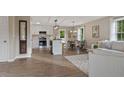 Bright, open floor plan integrating the living room, dining area, and a modern kitchen at 306 Birch St, Canton, GA 30114