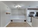 Bright dining area features built-in bench, modern lighting, and a view of the kitchen at 4106 Santa Fe Pkwy, Atlanta, GA 30350