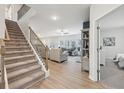 Inviting staircase leading to a spacious living room, offering a comfortable and connected living space at 1451 Stephens View Dr, Loganville, GA 30052