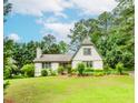 Charming two-story home with well-manicured lawn, beautiful landscaping, and mature trees at 529 Arnold Rd, Lawrenceville, GA 30044