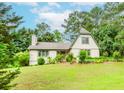 Charming two-story home with well-manicured lawn, beautiful landscaping, and mature trees at 529 Arnold Rd, Lawrenceville, GA 30044