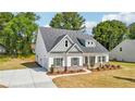 Well-maintained two-story home features a driveway and lush green lawn at 1411 Stephens View Dr, Loganville, GA 30052