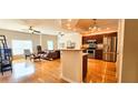 Open concept living and kitchen area with stainless appliances, hardwood floors, and recessed lighting at 2700 Pine Tree Ne Rd # 3009, Atlanta, GA 30324