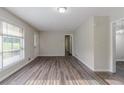 Cozy living room with hardwood floors, a front door entrance and interior hallway at 4029 Moffat Ct, Decatur, GA 30035