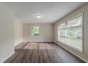 Bright living room with hardwood floors, natural light, and neutral paint at 4029 Moffat Ct, Decatur, GA 30035