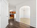 Elegant entryway features arched doorways leading to the kitchen and dining room at 7495 Garnet Dr, Jonesboro, GA 30236