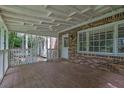 Back porch made of brick, wood and has a wooden roof at 9480 Coleman Rd, Roswell, GA 30075