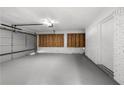 Spacious garage with room for two cars, painted walls and floor, and additional storage space at 2159 Fairburn Sw Rd, Atlanta, GA 30331