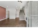 Bright entryway featuring hardwood floors and a staircase leading to the upper level at 2631 Creekside Nw Dr, Atlanta, GA 30318