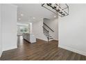 Open-concept space with wood floors, connecting living room and kitchen at 2631 Creekside Nw Dr, Atlanta, GA 30318
