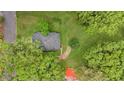 Aerial view of house featuring mature trees, gray roof, and a walkway leading to the home at 204 Morris St, Palmetto, GA 30268