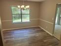 Bright dining room featuring neutral walls and a classic chandelier at 6743 Timbers East Dr, Lithonia, GA 30058