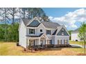 Charming two-story home featuring a classic design and well-maintained yard at 1452 Stephens View Dr, Loganville, GA 30052