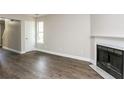 Bright living room with hardwood floors and a fireplace at 3474 Kingswood Run, Decatur, GA 30034