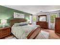 Spacious main bedroom with a large bed, lots of natural light, and matching furniture at 1341 Sheffield Glen Ne Way, Atlanta, GA 30329