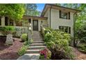 Charming two-story home entrance with steps leading to a front door at 1053 Crane Ne Rd, Atlanta, GA 30324