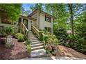 Inviting front entrance with stone steps and decorative landscaping at 1053 Crane Ne Rd, Atlanta, GA 30324