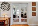 Double French doors lead to a cozy office space at 2707 Mariner Way, Villa Rica, GA 30180