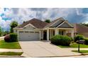 Charming single-story home featuring an attached garage, well-maintained lawn, and welcoming front facade at 2058 Bonneville Ln, Powder Springs, GA 30127