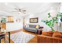 Inviting living room features hardwood floors, neutral walls, ceiling fan, and modern furnishings creating a cozy and stylish atmosphere at 228 Olympic Pl # 47, Decatur, GA 30030