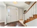 Bright entryway boasting hardwood floors, staircase, and natural light at 27 Jefferson Hill Ne Pl, Atlanta, GA 30342