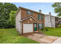 Lovely brick house with a one-car garage and verdant lawn at 3949 Riverside Pkwy, Decatur, GA 30034