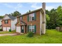 A brick two-story home with green shutters and a well-maintained lawn at 3949 Riverside Pkwy, Decatur, GA 30034