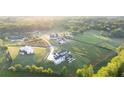 Beautiful community with modern farmhouses set amidst lush greenery and mature trees at 5160 Howard A Rd, Cumming, GA 30040