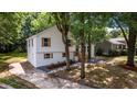 Eye-catching home with fresh exterior paint, lovely landscaping, walkway, and inviting entry stairs at 8420 Sheridan Dr, Jonesboro, GA 30236